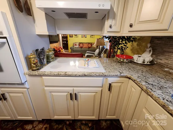 a kitchen with sink and window