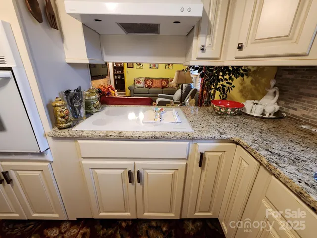 a kitchen with sink and window