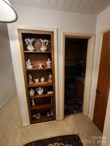 a bathroom with a sink mirror and toilet