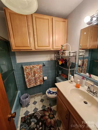 a bathroom with a glass shower door