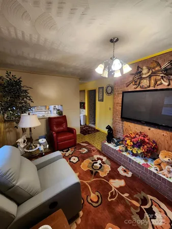 a view of a field with trees in the background