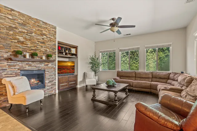 a living room with furniture and a fireplace