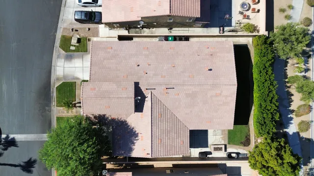an aerial view of residential houses with outdoor space