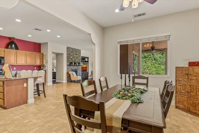 a dining room with furniture and window