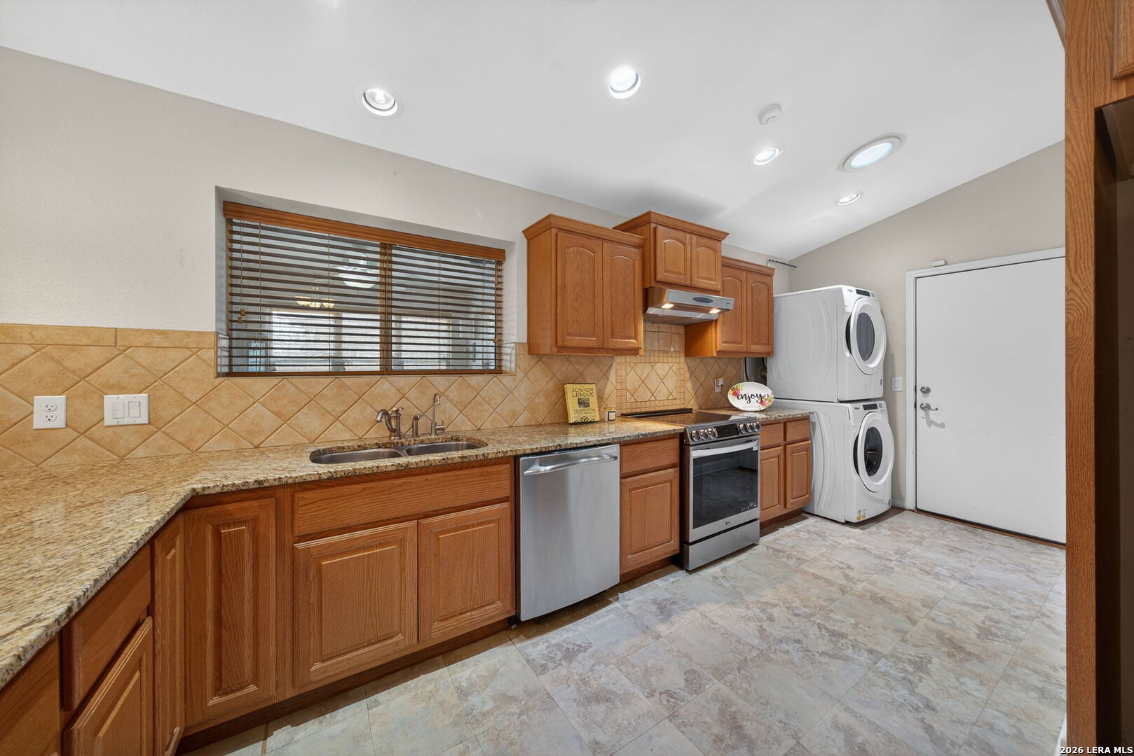 121 Fort Wayne Universal City, TX 78148 - Photo 15 of 34 a large kitchen with stainless steel appliances granite countertop a sink and cabinets