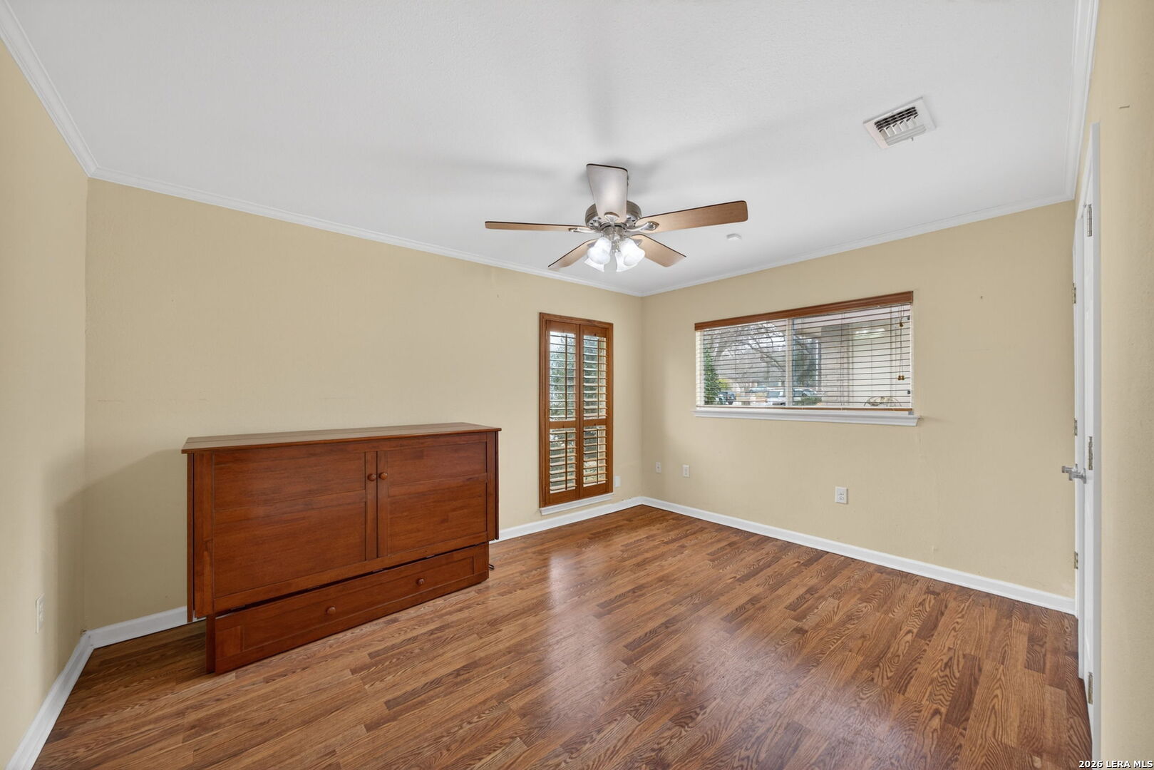 121 Fort Wayne Universal City, TX 78148 - Photo 28 of 34 a view of an empty room with wooden floor and a window