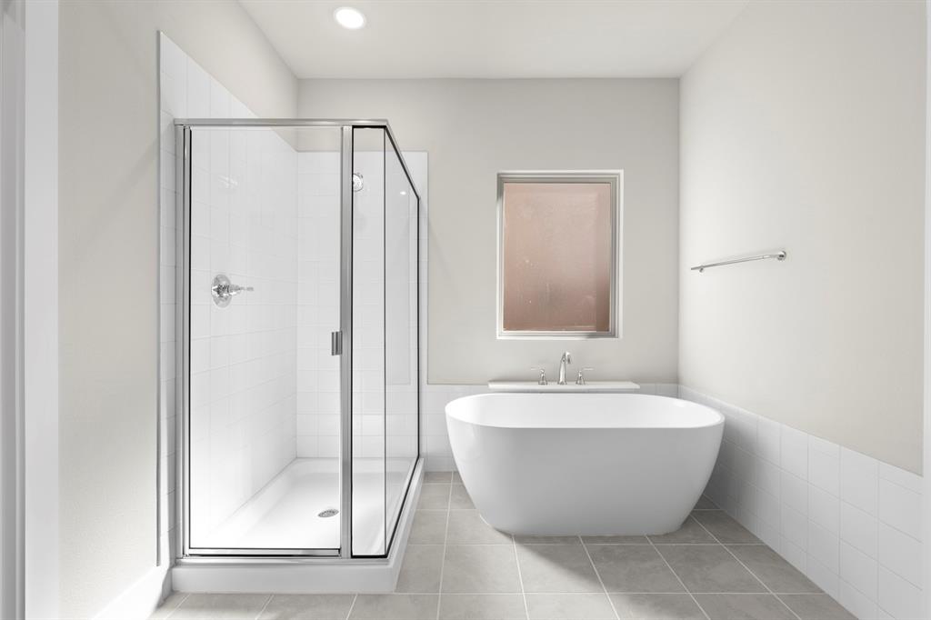 2359 Bell Way Forney, TX 75126 - Photo 13 of 31 a white bath tub sitting next to a bathroom sink