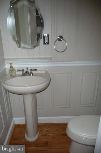 3104 King Tree Street Silver Spring, MD 20902 - Photo 22 of 28 a bathroom with a sink a toilet and mirror