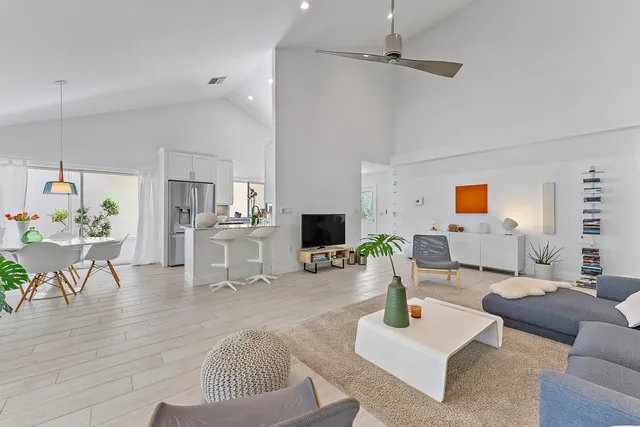 a bedroom with a bed and a television