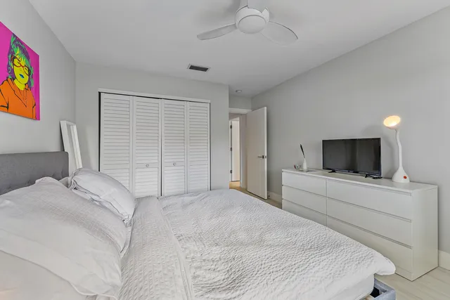 a living room with furniture and large windows