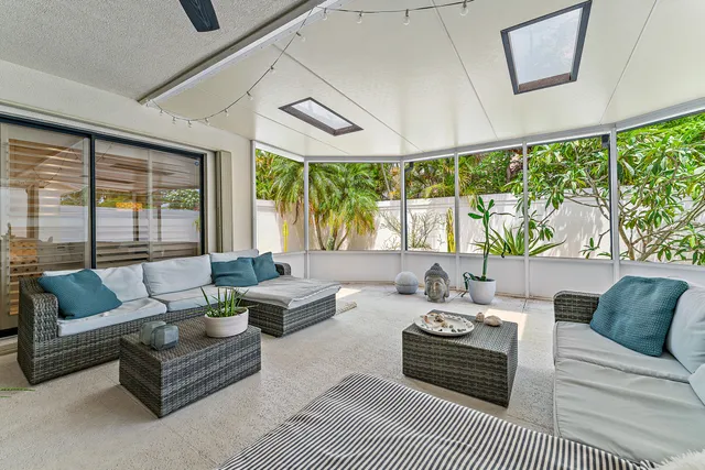 a dining room with furniture garden view and a potted plant