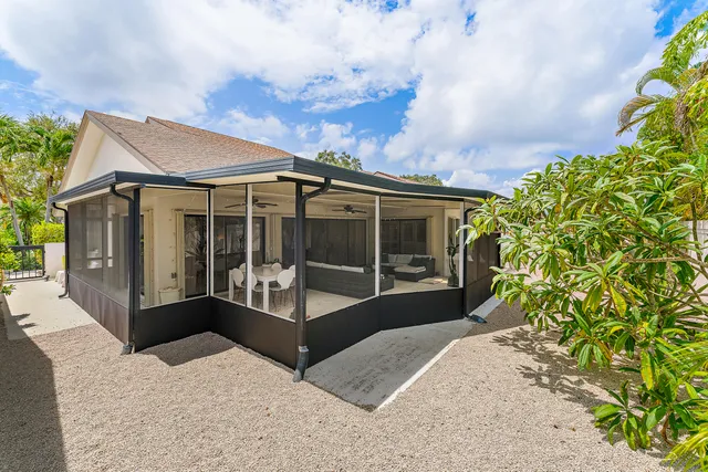 a view of a lobby with a chair and potted plant