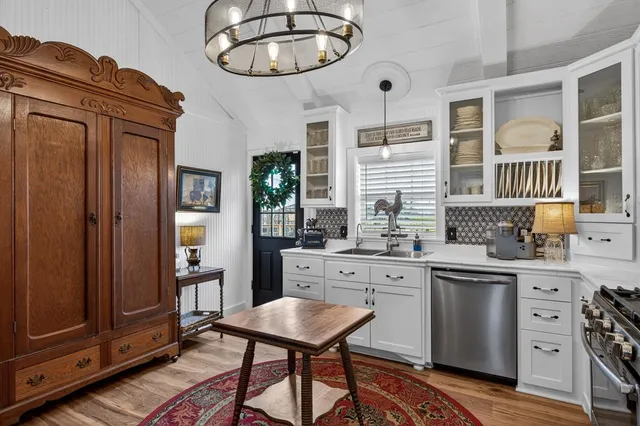 a kitchen with cabinets and outdoor view