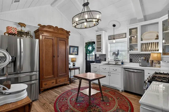 a picture of a room with a front door and a mirror