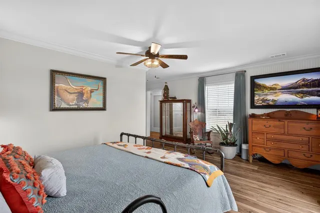 a en suite bathroom with a granite countertop toilet sink and mirror