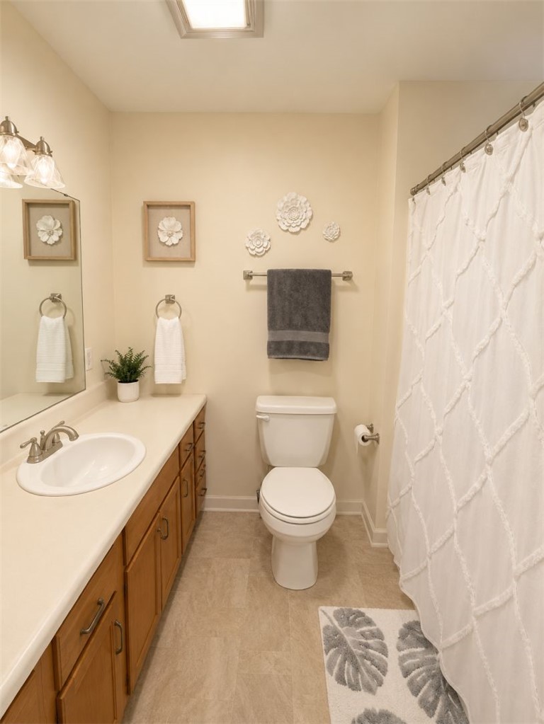 2018 Cardinal Park Drive Anderson, SC 29621 - Photo 9 of 11 Functional full bathroom featuring a generous vanity with integrated sink and practical flooring.
