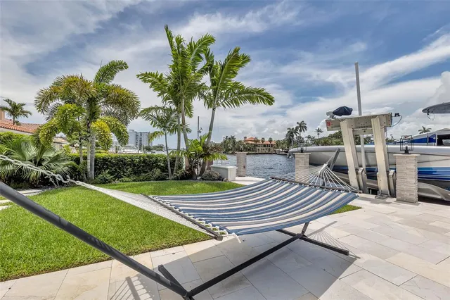 a view of a backyard with sitting area