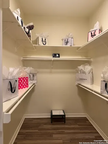 a bathroom with a tub a sink and a mirror