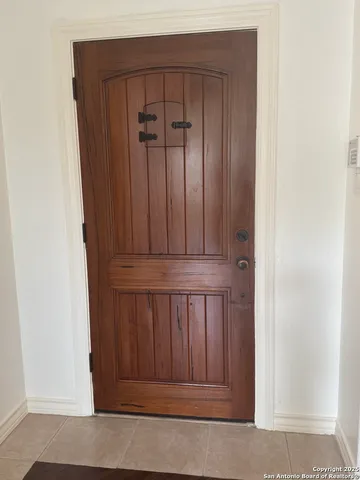 a view of room with window and hardwood floor