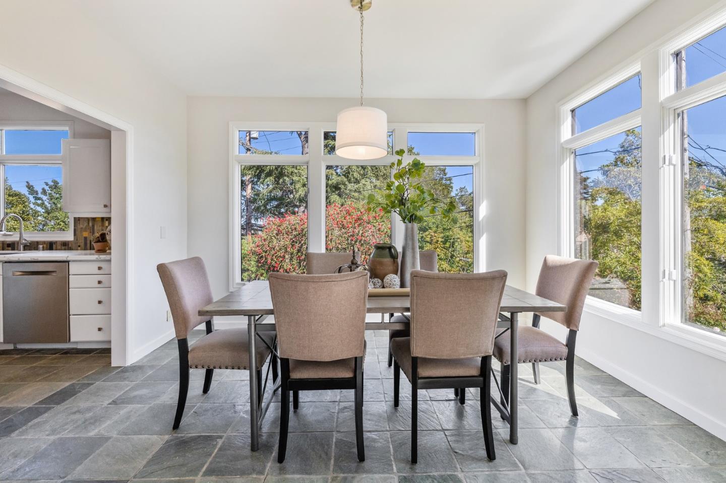 541 Nevada Avenue San Mateo, CA 94402 - Photo 33 of 100 a dining room with furniture a window and a chandelier