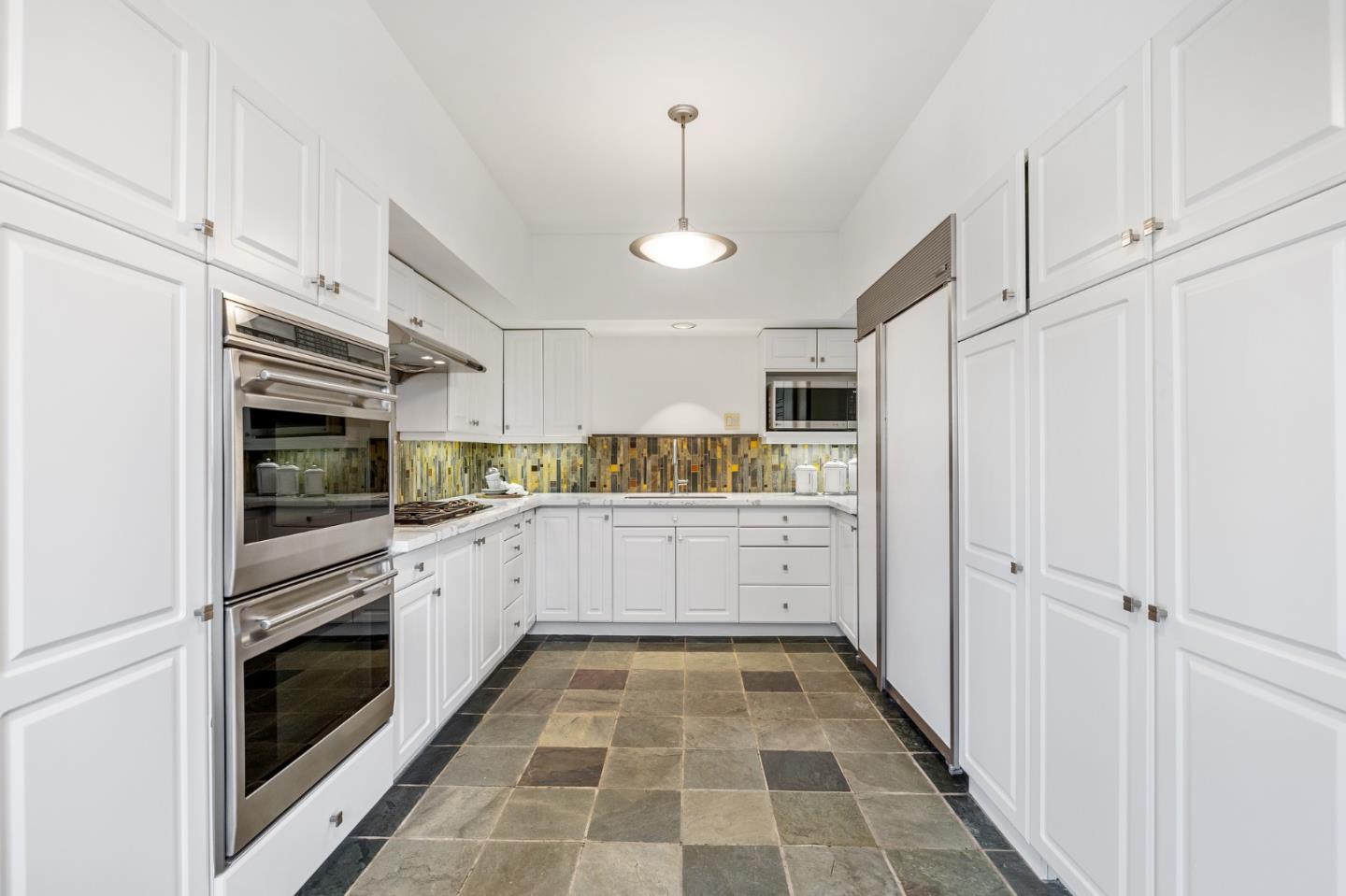 541 Nevada Avenue San Mateo, CA 94402 - Photo 38 of 100 a kitchen with granite countertop stainless steel appliances and white cabinets