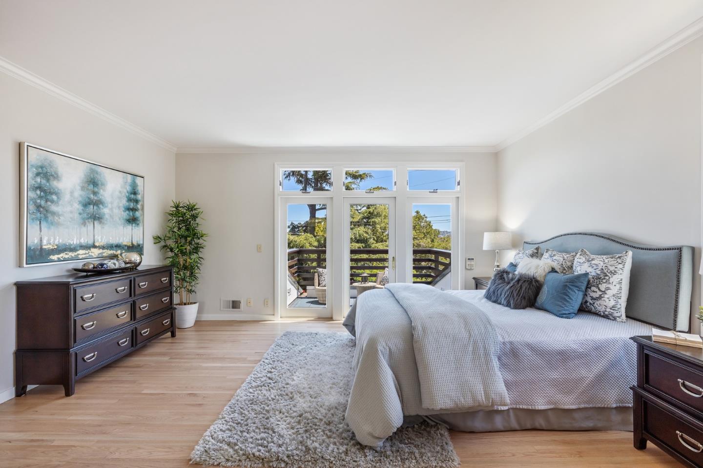 541 Nevada Avenue San Mateo, CA 94402 - Photo 59 of 100 a bedroom with a large bed and a flat tv screen on dresser