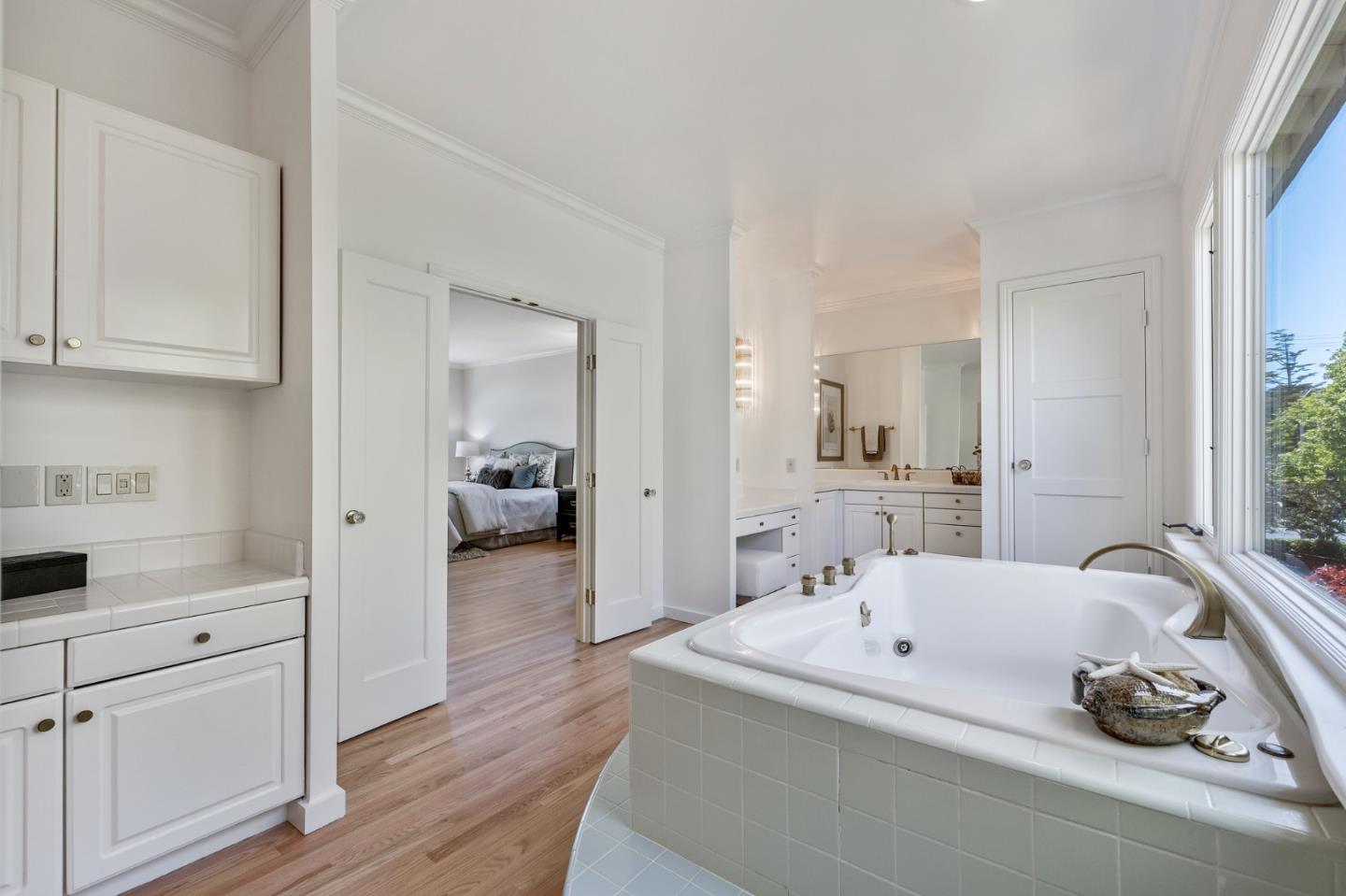 541 Nevada Avenue San Mateo, CA 94402 - Photo 69 of 100 a en suite bathroom with a double vanity sink and a mirror