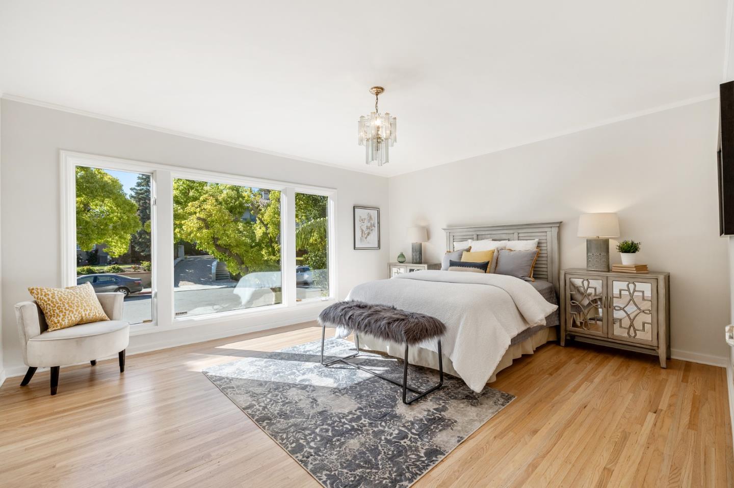 541 Nevada Avenue San Mateo, CA 94402 - Photo 81 of 100 a spacious bedroom with a bed and large windows