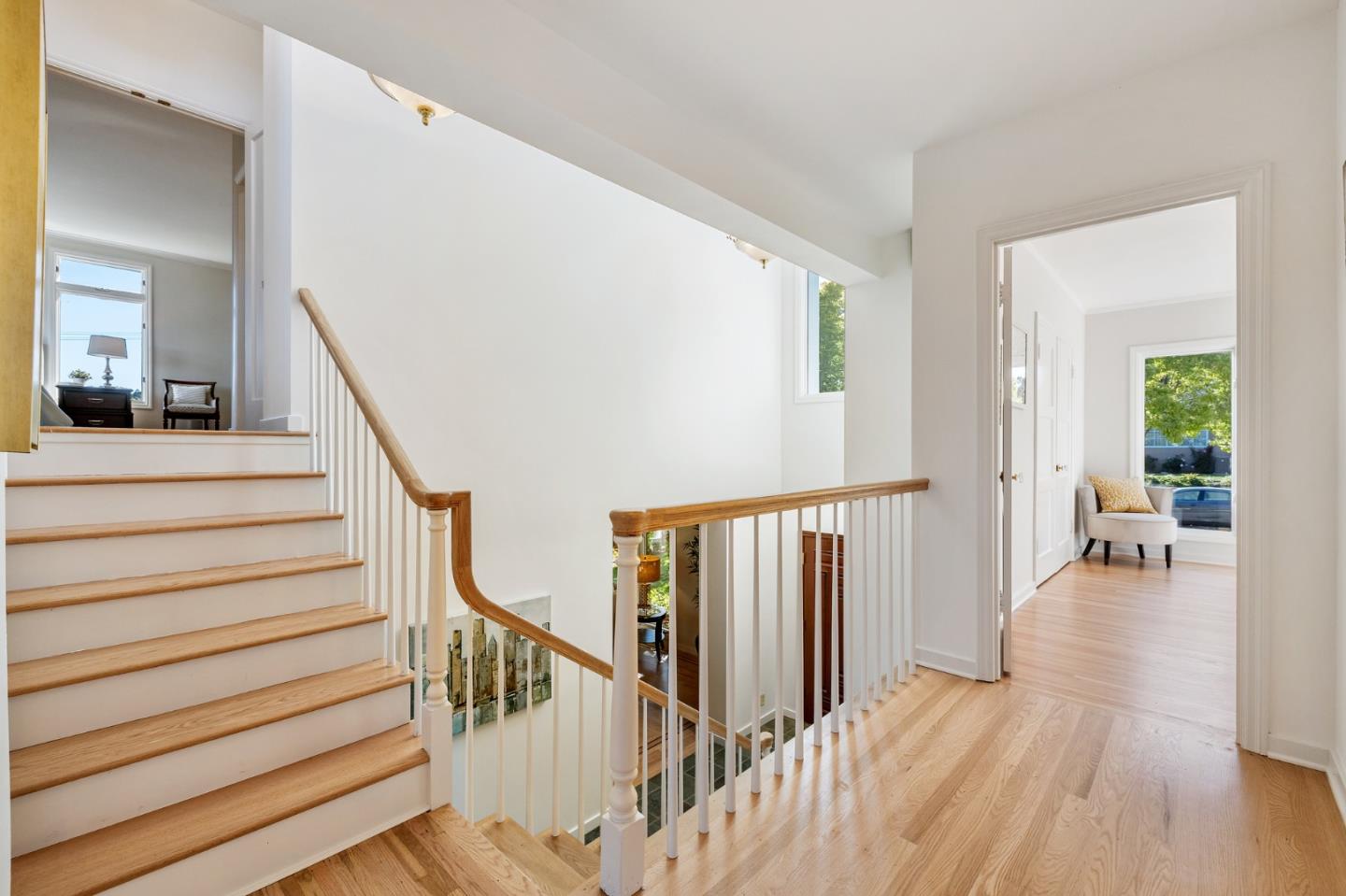 541 Nevada Avenue San Mateo, CA 94402 - Photo 89 of 100 a view of staircase with lots of frames on wall and wooden floor