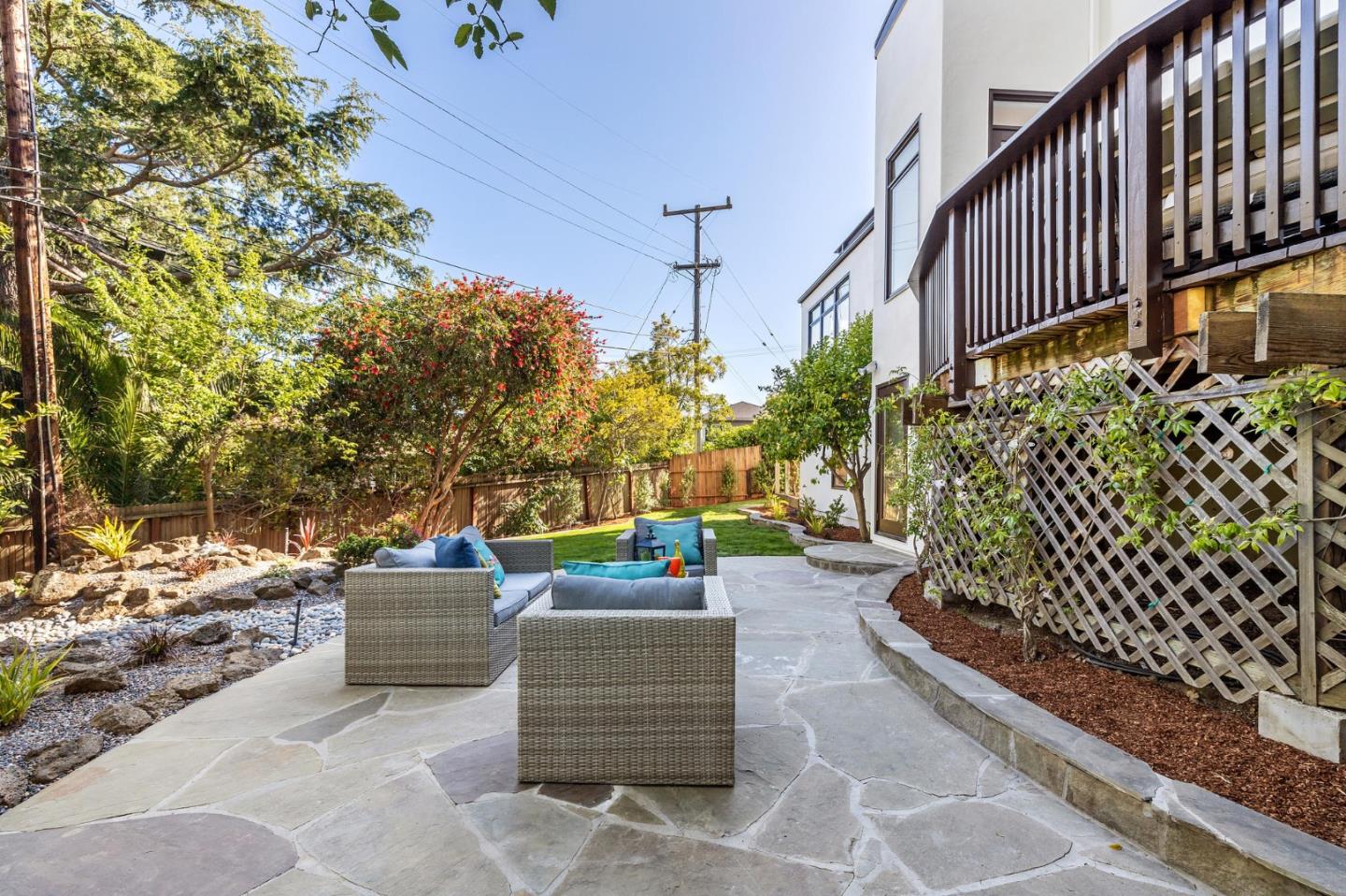 541 Nevada Avenue San Mateo, CA 94402 - Photo 99 of 100 a view of a patio with couches and table and chairs and wooden fence