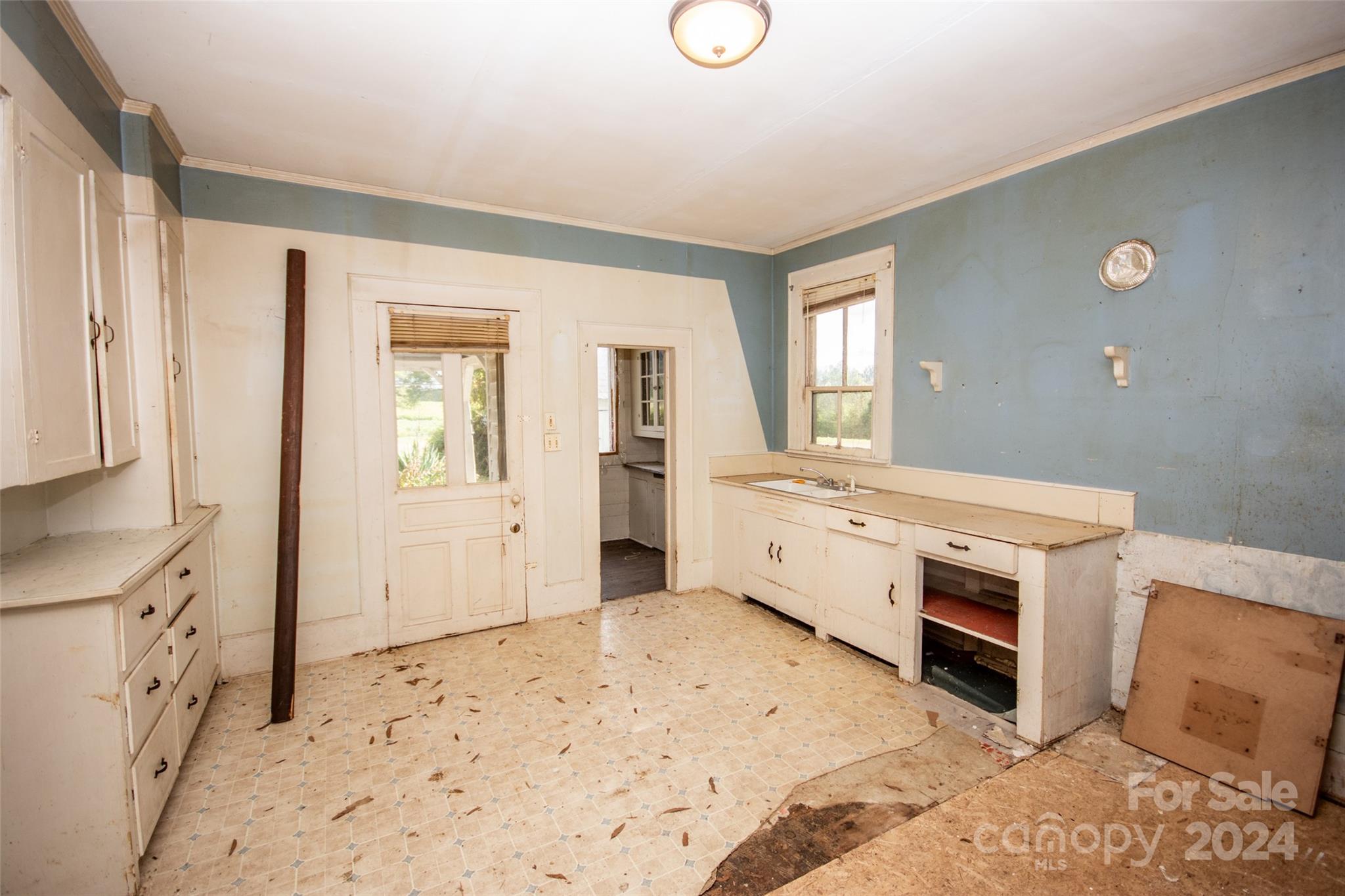 431 Friendship Road Olin, NC 28660 - Photo 13 of 44 a room with a sink and a dresser