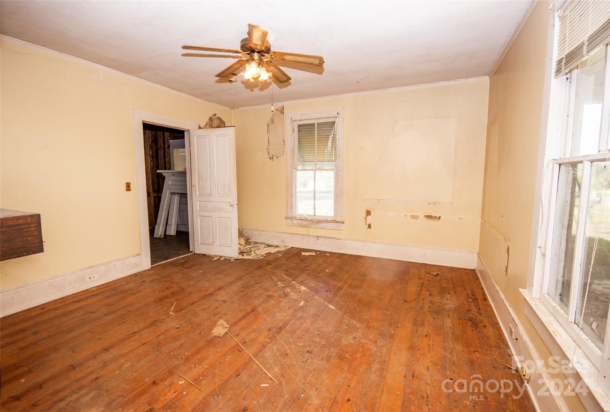 431 Friendship Road Olin, NC 28660 - Photo 19 of 44 wooden floor in an empty room with a window