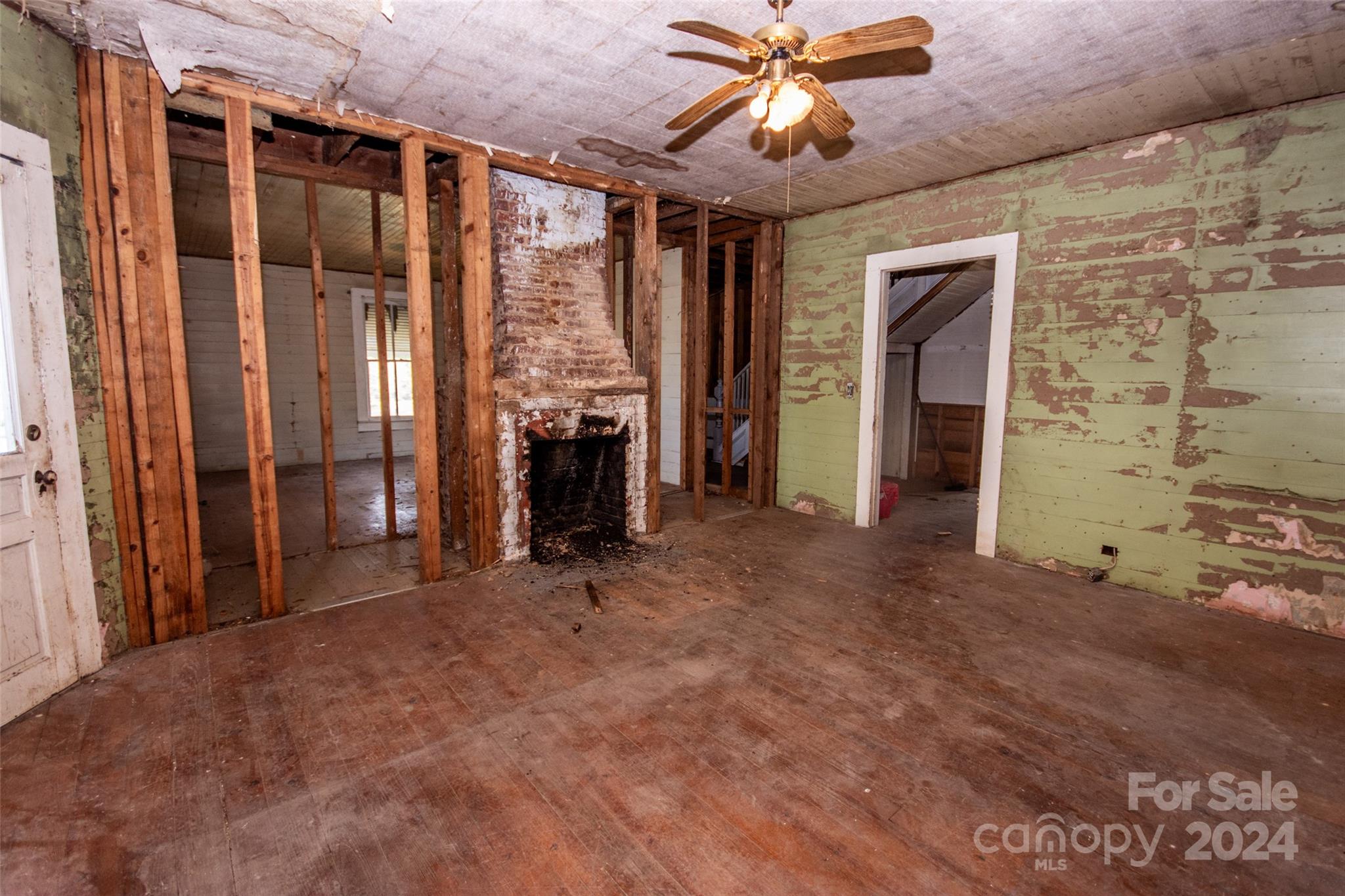 431 Friendship Road Olin, NC 28660 - Photo 24 of 44 wooden floor and window in an empty room