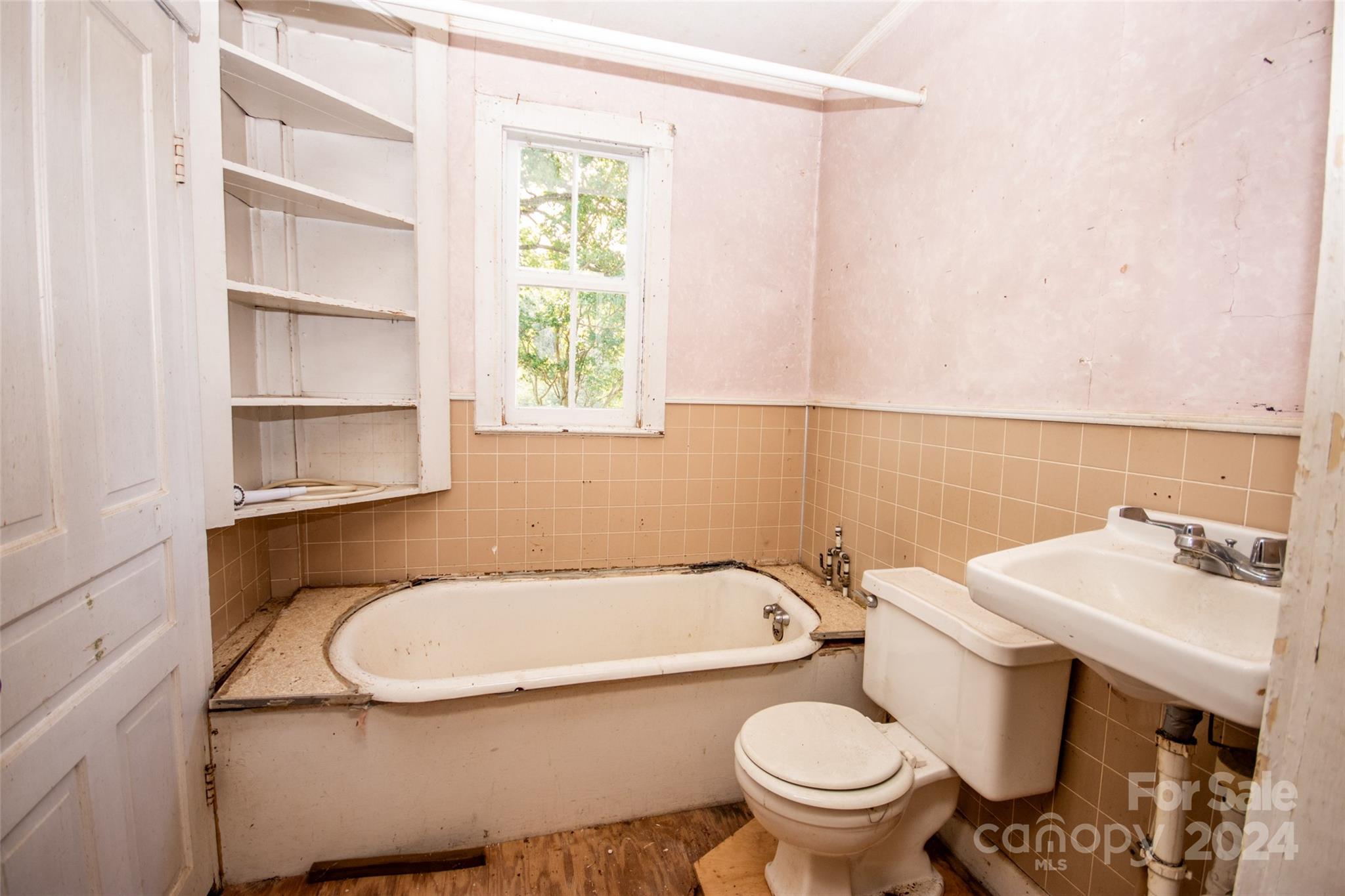 431 Friendship Road Olin, NC 28660 - Photo 25 of 44 a bathroom with a sink a toilet and a bathtub