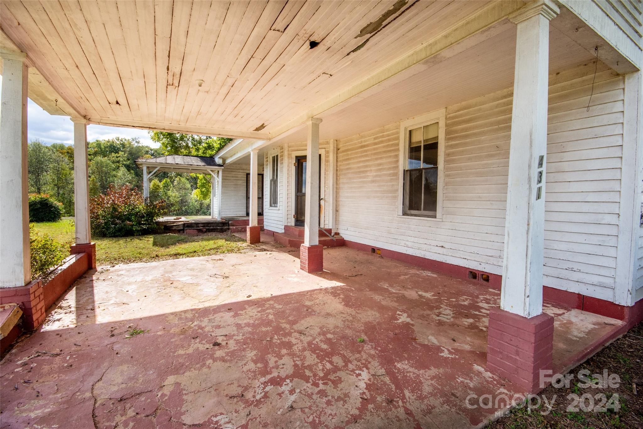 431 Friendship Road Olin, NC 28660 - Photo 32 of 44 a view of a house with backyard porch and sitting area