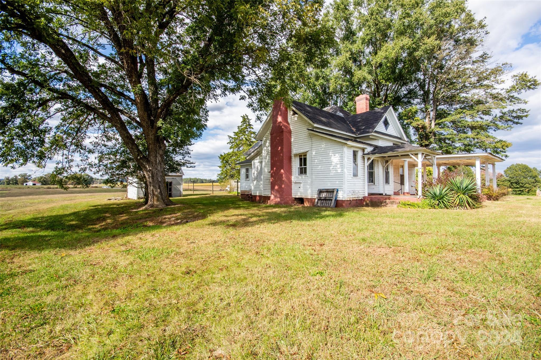 431 Friendship Road Olin, NC 28660 - Photo 36 of 44 a view of a house with pool and a yard