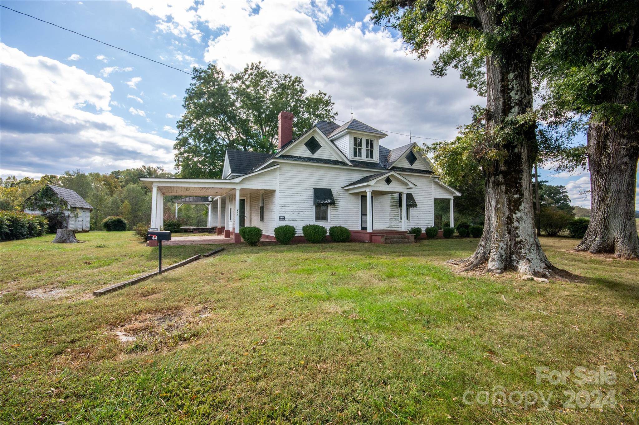 431 Friendship Road Olin, NC 28660 - Photo 44 of 44 a house with green field in front of it