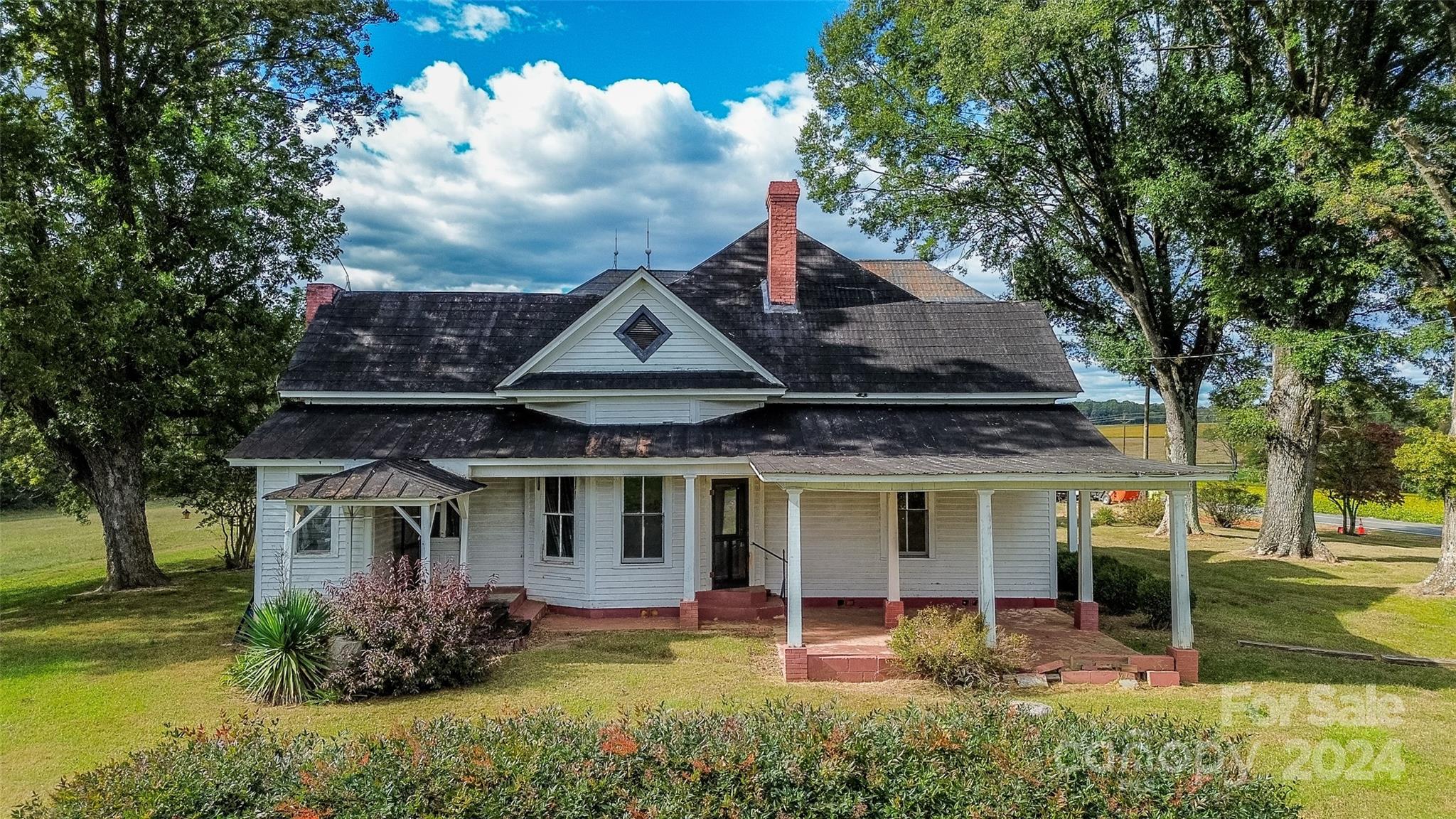 431 Friendship Road Olin, NC 28660 - Photo 5 of 44 a front view of a house with garden