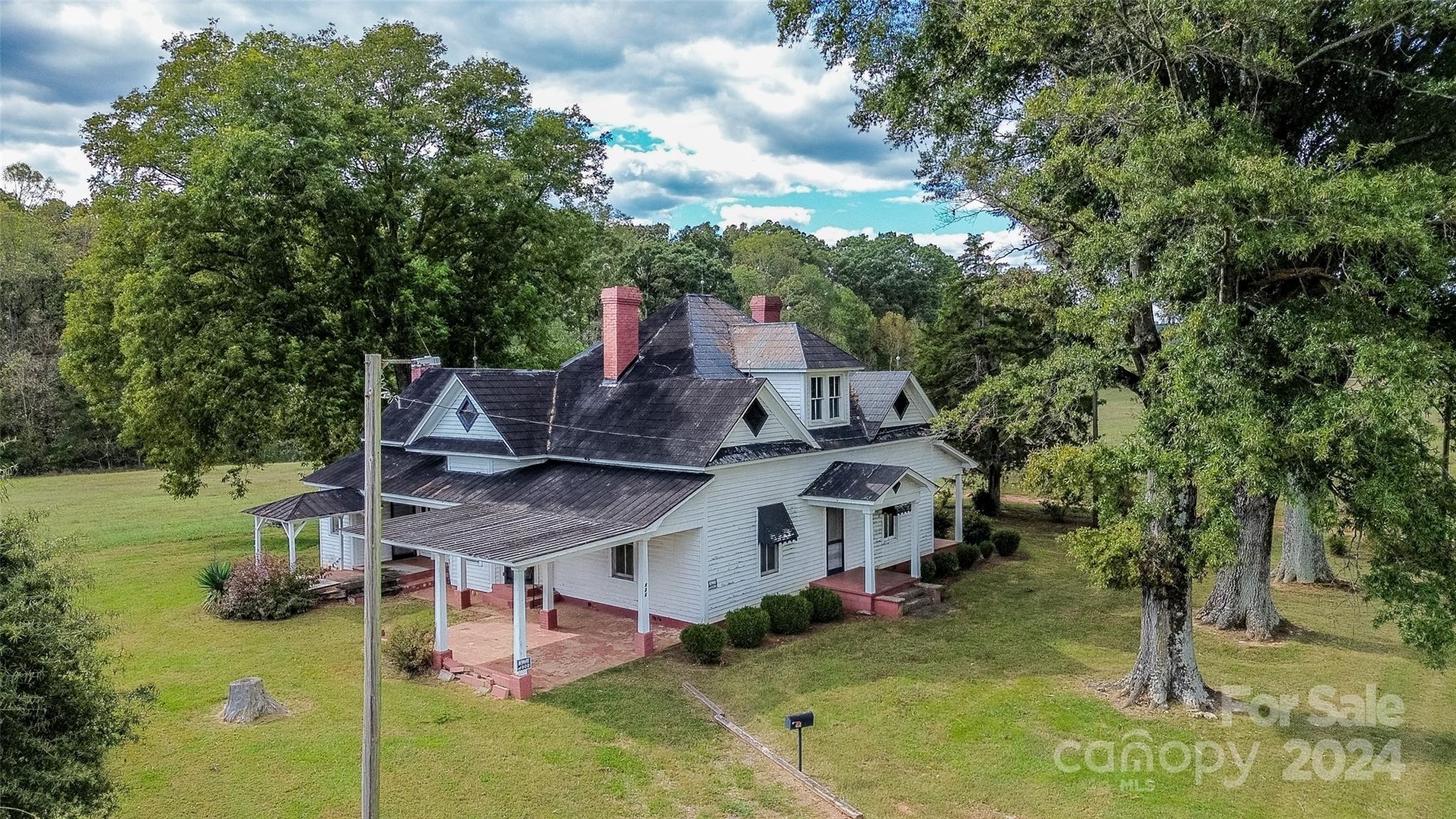 431 Friendship Road Olin, NC 28660 - Photo 6 of 44 an aerial view of a house with swimming pool next to a yard