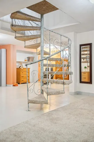 a view of entryway with furniture and livingroom