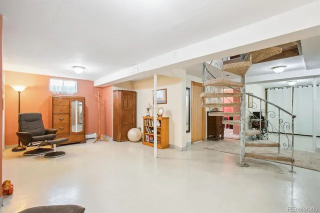 a view of a livingroom with furniture and a flat screen tv
