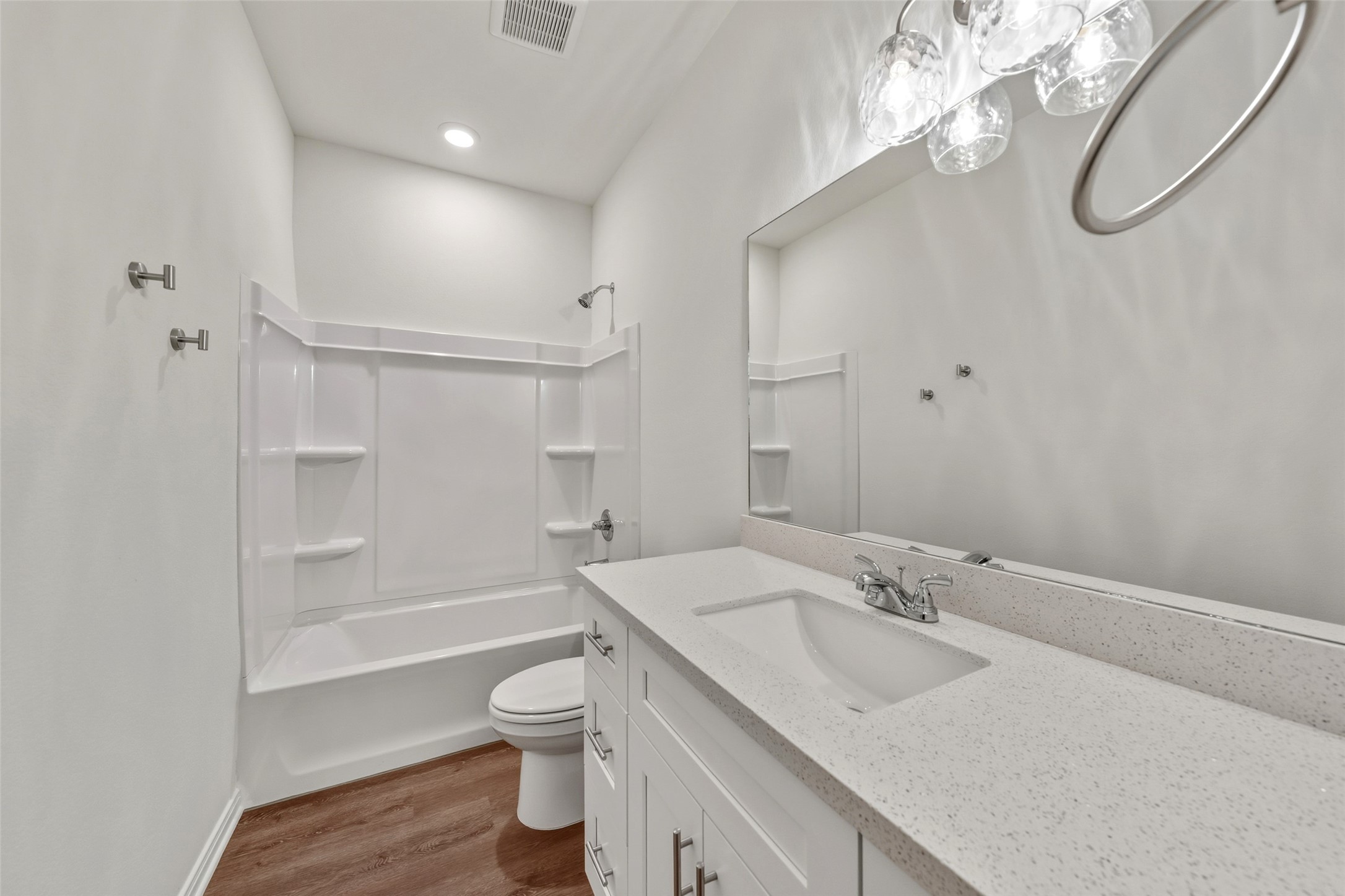 708 West Dallas Street Conroe, TX 77301 - Photo 17 of 19 a bathroom with a granite countertop sink toilet and shower