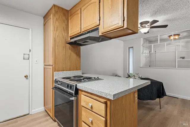 a kitchen with stainless steel appliances granite countertop a refrigerator sink and cabinets