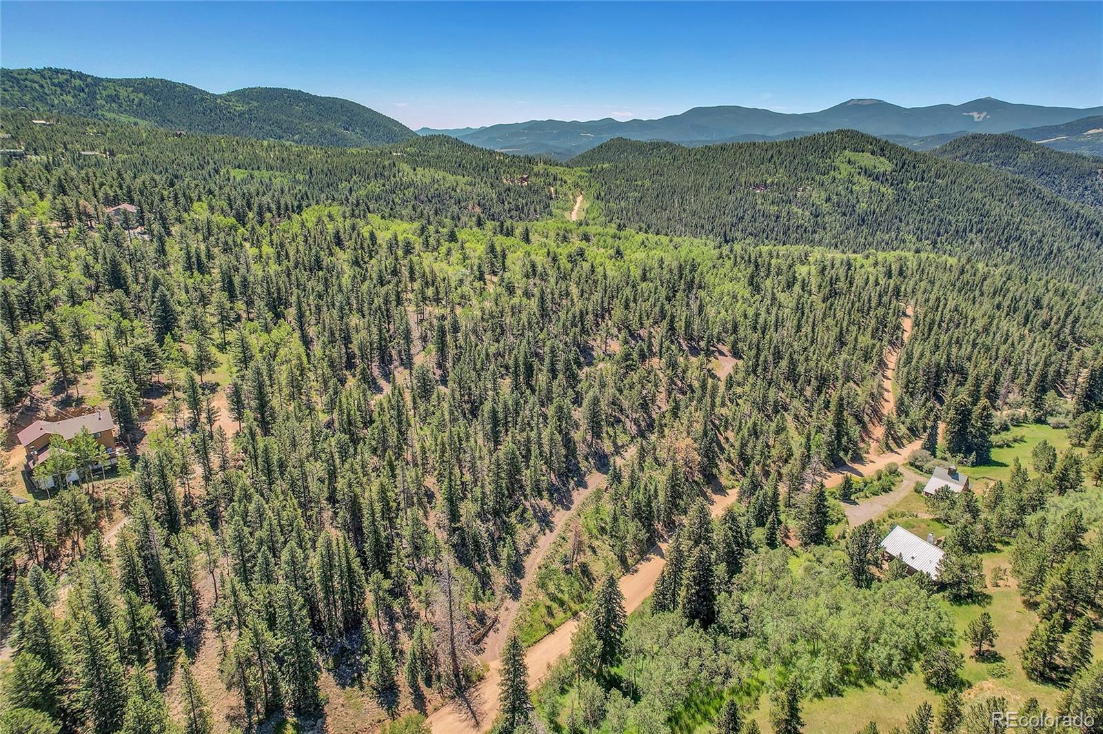 5 Hughesville Road Black Hawk, CO 80422 - Photo 3 of 17 a view of a mountain range with lush green forest
