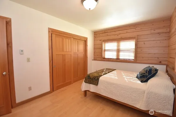 a bedroom with a bed and window