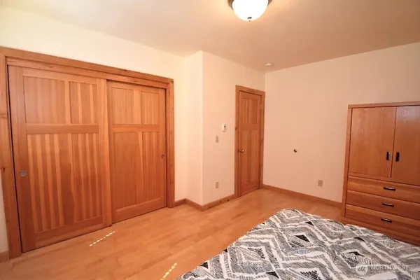 a bathroom with a double vanity sink toilet and a mirror