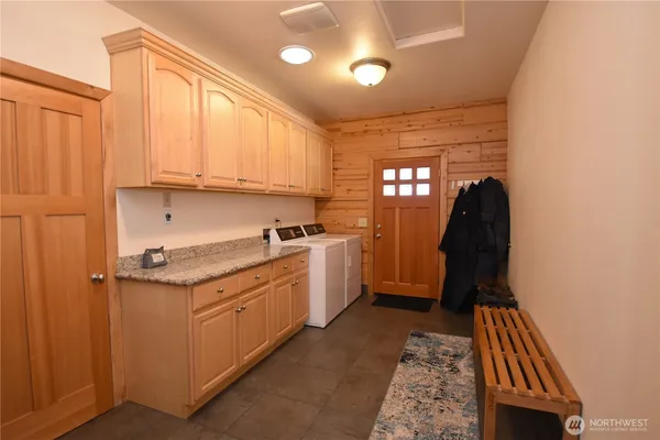 a view of kitchen with kitchen island and living room