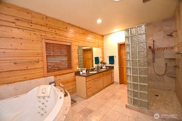 a bathroom with a sink mirror and toilet