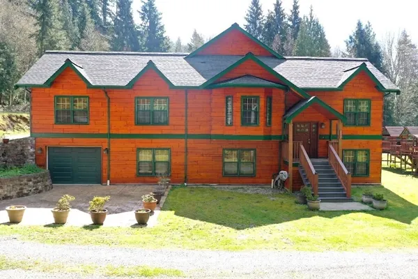 a front view of a house with a yard