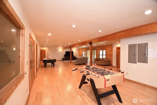 a view of a room with gym equipment and large window